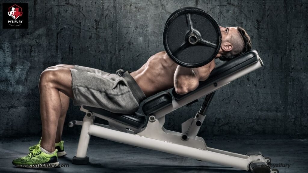 A dedicated male athlete performing an incline bench press in a gym, intensely lifting a weight plate above his chest, exemplifying focus and strength in a gritty workout environment, with the logo and website of Physifury visible.